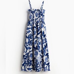 Blue and White smocked floral dress in Medium. Worn once. Perfect for Greece! 🇬🇷